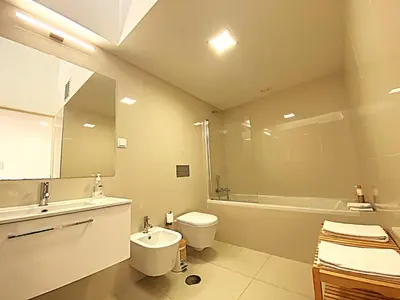 a bathroom with a sink and a toilet and a tub at PORTO SWEETHEART - Almada in Porto