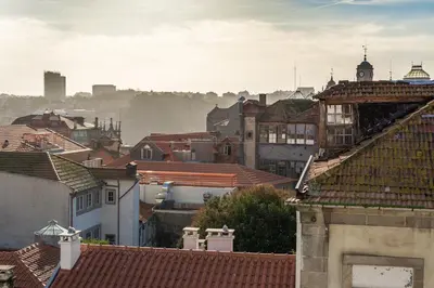 a view of a city with roofs and buildings at Loft 72 in Porto