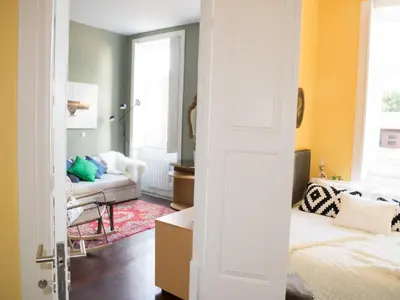 a living room with a bed and a couch at Merc Porto Central Place in Porto