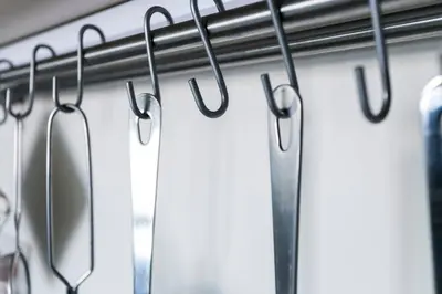 a row of hooks hanging on a wall at Santa Catarina Cozy Nest - Porto Downtown in Porto