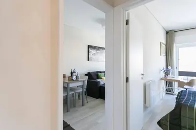 a hallway leading into a living room with a table at Santa Catarina Cozy Nest - Porto Downtown in Porto