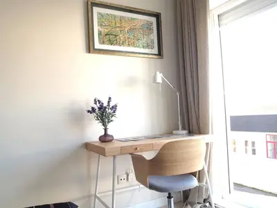 a desk with a chair next to a window at Santa Catarina Cozy Nest - Porto Downtown in Porto