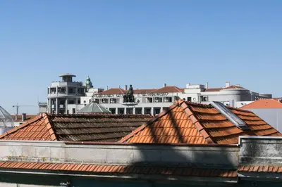a group of roofs with buildings in the background at Santa Catarina Cozy Nest - Porto Downtown in Porto