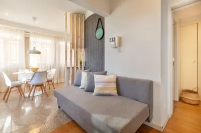 a living room with a couch and a table at D&S - Ribeira Premium Apartments in Porto