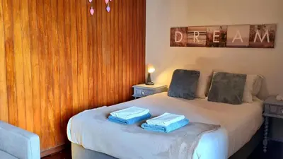 a bedroom with a bed with two towels on it at Studio DOWNTOWN in Porto