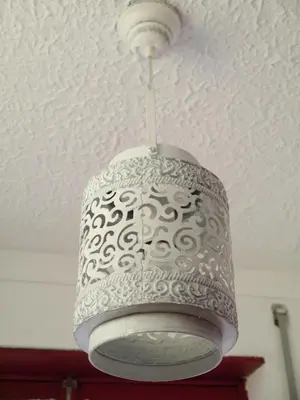 aendant light hanging from a ceiling in a room at Apartamento Boavista in Vila Nova de Gaia
