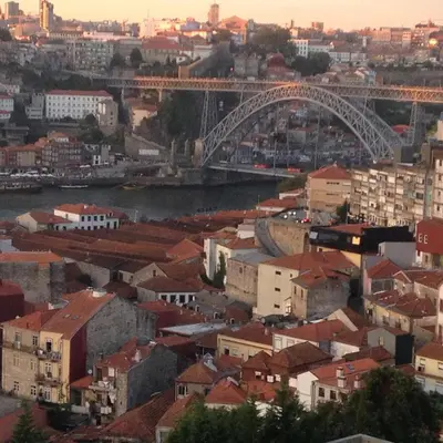 a view of a city with a bridge and buildings at Cozy Flat Porto Downtown in Porto