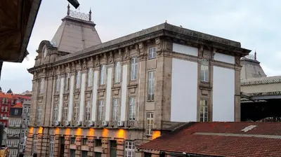 a large building with a tower on top of it at Sendme2Portugal: Loureiro in Porto