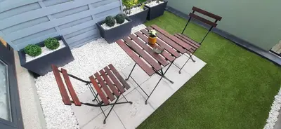 a patio with two chairs and a fire hydrant at Boavista Class Inn in Porto