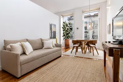 a living room with a couch and a table at Studio Sta in Porto