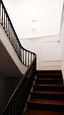 a staircase in a building with a large window at Studio Sta in Porto