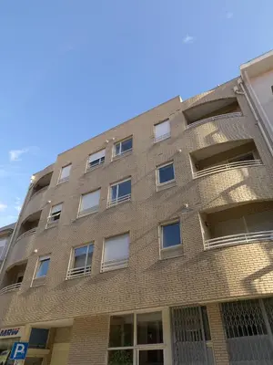 a brick building with windows on the side of it at FLH Porto Comfort Flat in Porto
