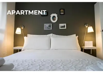 a bedroom with a bed and a sign that reads appointment at BCharming House in Porto