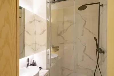 a bedroom with a bed and a mirror at N Apartments - Chã in Porto