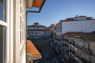 a stairwell with a black carpet and wooden floors at N Apartments - Chã in Porto