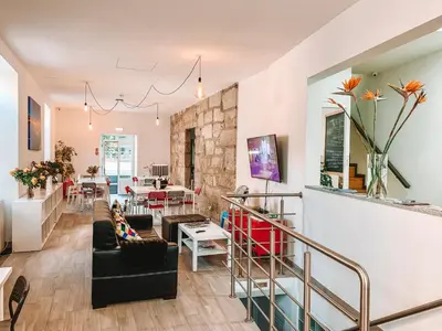 a living room with a couch and a table at Urban Garden Porto Central Hostel in Porto