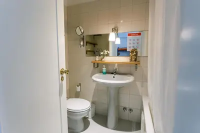 a bathroom with a sink and a toilet at PortoVivo Quental Apartamento in Porto
