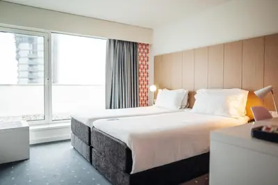 a hotel room with a large bed and a window at Stay Hotel Porto Centro Trindade in Porto