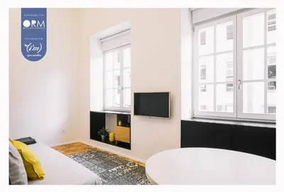 a room with a white couch with yellow pillows at ORM - Saraiva de Carvalho Apartments in Porto