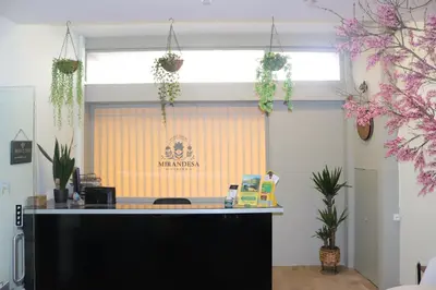 an office with a reception desk with a window at Mirandesa Garden in Porto