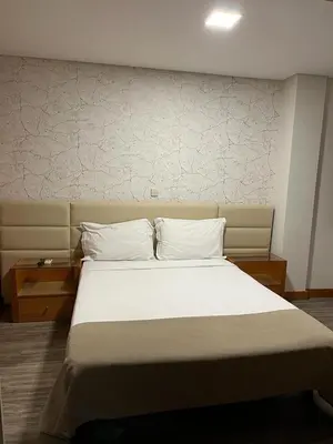 a bedroom with a large bed with white sheets and pillows at Seculo apartments in Porto