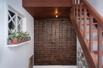 a bedroom with a bed and a table and chairs at The Brewmaster's House in Porto