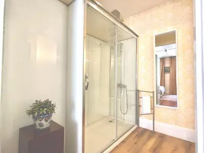 a bedroom with a bed with a mirror on the wall at The Brewmaster's House in Porto