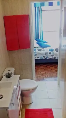 a bathroom with a toilet and a sink and a shower at Bombarda House & Home in Porto