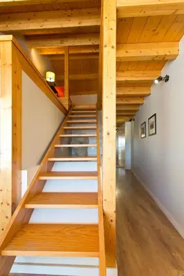 a staircase in a house with wooden ceilings at RVA - Sao Joao Novo Apartments in Porto