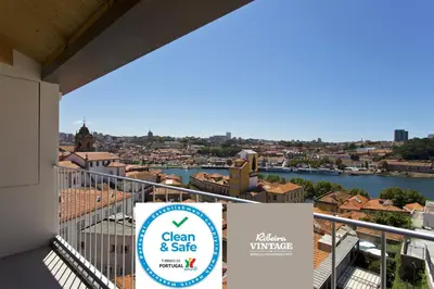 a sign on a balcony with a view of a city at RVA - Sao Joao Novo Apartments in Porto