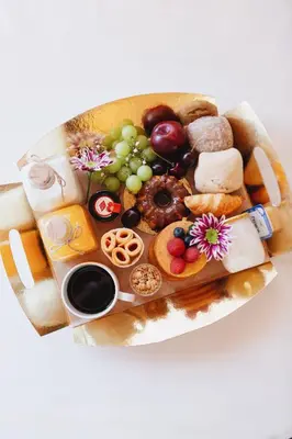 a plate of food with different types of foods at ORM - Cativo Apartments in Porto