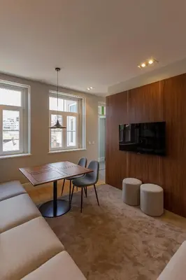 a living room with a table and a tv at ORM - Bolhao Apartments in Porto