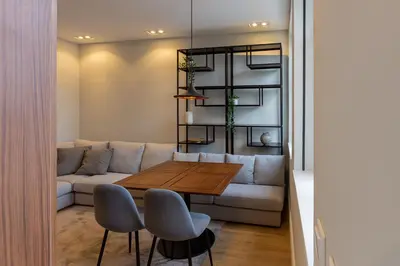 a living room with a couch and a table and chairs at ORM - Bolhao Apartments in Porto