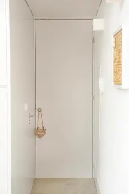 a white bathroom with a glass shower door at Lovely Mezzanine in Porto with FREE PARKING in Porto