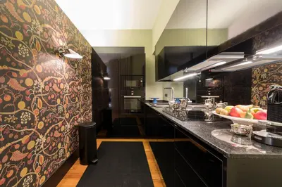a kitchen with a counter with a bowl of fruit on it at Deco Gem Aliados in Porto