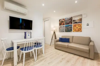 a living room with a couch and a table at BRA.com Apartments Oporto Campanhã in Porto
