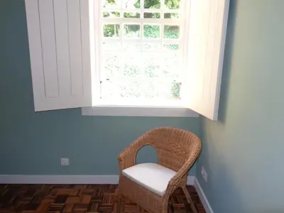 a window in a room with a chair under it at Ribeira Apartment in Porto