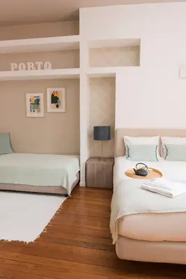 a dining room with a table and a chair at Santo da Casa / Sc apartments in Porto