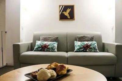 a living room with a couch and a table at Santo da Casa / Sc apartments in Porto