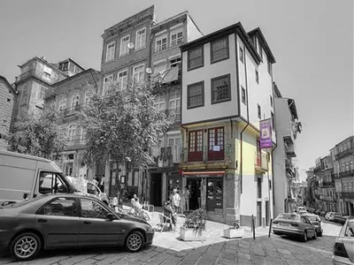 a car parked in front of a building on a street at Koka's Studio in Porto