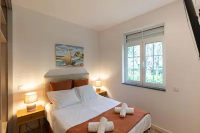 a living room with a couch and a table at Best House Center - with Garage in Porto