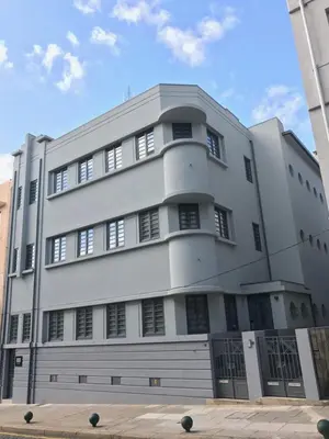 a large white building with black windows at Oporto Serviced Apartments - Alvares Cabral in Porto