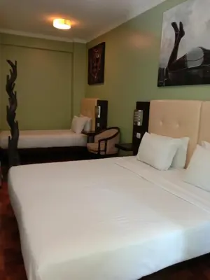 a bedroom with a large white bed and a couch at Faria Guimares Porto Centro in Porto