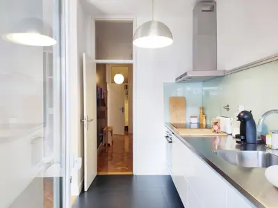 a bedroom with a large bed and a blue chair at E36 - ideal for families - large areas in Porto