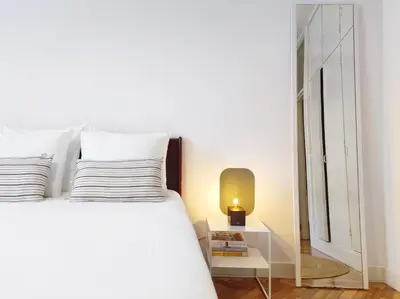 a bedroom with a white bed and a white closet at E36 - ideal for families - large areas in Porto