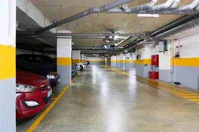 a parking garage with cars parked in it at Serviced Apartments Boavista Palace in Porto