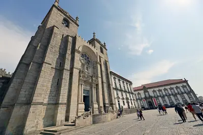 a group of people walking in front of a building at FLH Porto Stylish Apartment in Porto