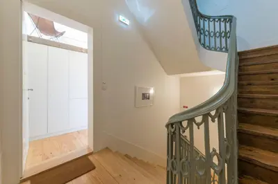 a staircase in a house with a window at LovelyStay - Cativo Mezzanine Studio in Porto