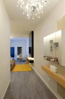 a living room with a chandelier at LETHESHOME Apartments in Porto