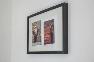 a framed picture of a movie poster on a wall at Apartamento À Francos Balcony in Porto